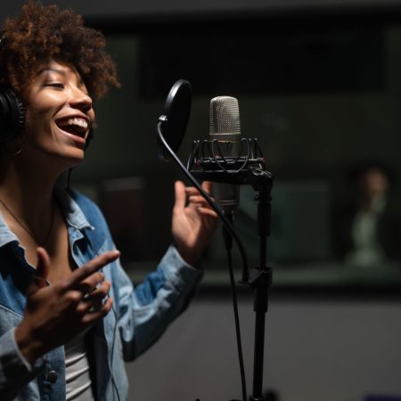 An,Young,Professional,Smiling,Energetic,African,Female,Singer,Wearing,Headphones